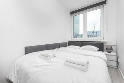 Łóżko lub łóżka w pokoju w obiekcie Apartamenty Pańska by Your Freedom