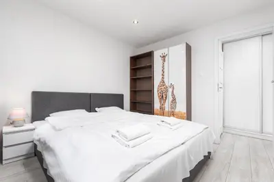 Łóżko lub łóżka w pokoju w obiekcie Apartamenty Pańska by Your Freedom