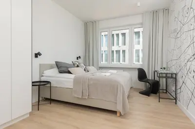 Łóżko lub łóżka w pokoju w obiekcie Amazing Spacious Apartments in Warsaw City Center by Noclegi Renters