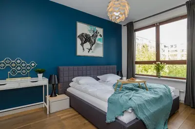 Łóżko lub łóżka w pokoju w obiekcie ShortStayPoland Rydygiera (B128)