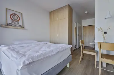 Łóżko lub łóżka w pokoju w obiekcie Noli Mokotow
