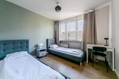 Łóżko lub łóżka w pokoju w obiekcie Warsaw Concierge Pańska 61
