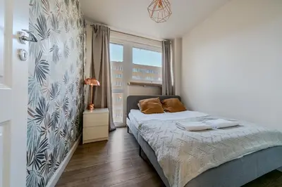 Łóżko lub łóżka w pokoju w obiekcie Warsaw Concierge Pańska 61