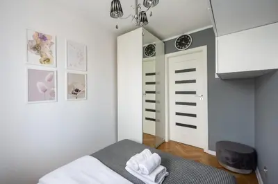Łóżko lub łóżka w pokoju w obiekcie Wola Okopowa Luxury Apartment by BookingHost