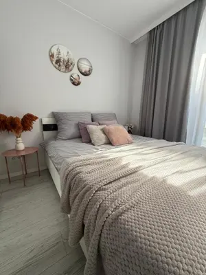 Łóżko lub łóżka w pokoju w obiekcie Apartment Mokotów blisko lotniska Chopina