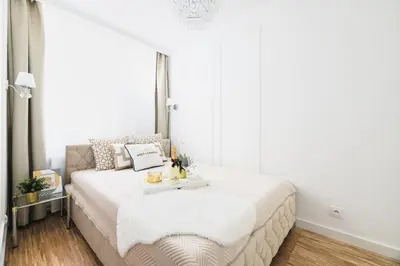 Łóżko lub łóżka w pokoju w obiekcie Glam & Modern by Cooee Apartments