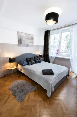 Łóżko lub łóżka w pokoju w obiekcie ClickTheFlat Muranów Apart Rooms
