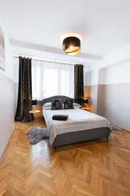 Łóżko lub łóżka w pokoju w obiekcie ClickTheFlat Muranów Apart Rooms