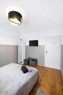 Łóżko lub łóżka w pokoju w obiekcie ClickTheFlat Muranów Apart Rooms