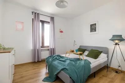Łóżko lub łóżka w pokoju w obiekcie ShortStayPoland Jana Olbrachta (B40)