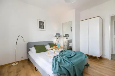 Łóżko lub łóżka w pokoju w obiekcie ShortStayPoland Jana Olbrachta (B40)