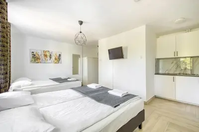 Łóżko lub łóżka w pokoju w obiekcie Labo Apartment Niepodległości