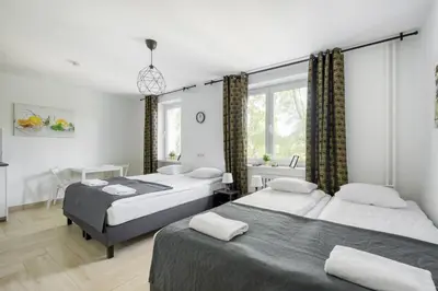 Łóżko lub łóżka w pokoju w obiekcie Labo Apartment Niepodległości