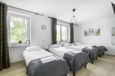 Łóżko lub łóżka w pokoju w obiekcie Labo Apartment Niepodległości