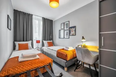 Łóżko lub łóżka w pokoju w obiekcie Aparthotel Grzybowska 9 by BookingHost