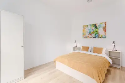Łóżko lub łóżka w pokoju w obiekcie Warsaw City Apartments Kolejowa