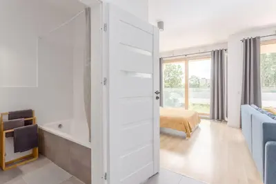 Łóżko lub łóżka w pokoju w obiekcie Warsaw City Apartments Kolejowa