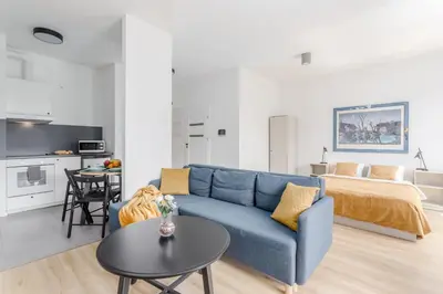 Łóżko lub łóżka w pokoju w obiekcie Warsaw City Apartments Kolejowa
