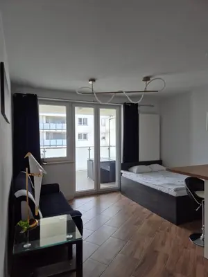 Łóżko lub łóżka w pokoju w obiekcie Apartament Golden Flight