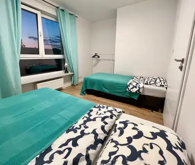 Łóżko lub łóżka w pokoju w obiekcie K22 Large Family Apart Komputerowa