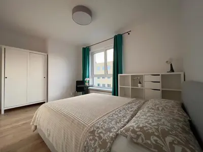 Łóżko lub łóżka w pokoju w obiekcie K22 Large Family Apart Komputerowa