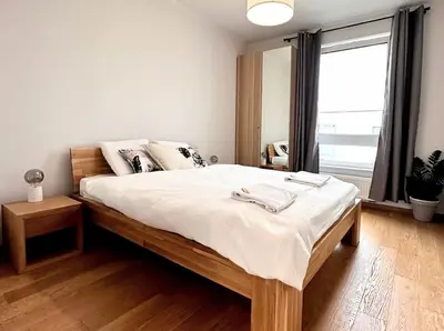 Łóżko lub łóżka w pokoju w obiekcie Warsaw Concierge Chrzanowskiego