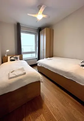Łóżko lub łóżka w pokoju w obiekcie Warsaw Concierge Chrzanowskiego