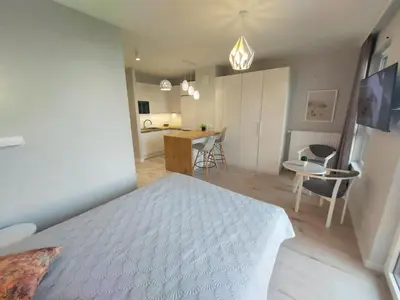Telewizja i/lub zestaw kina domowego w obiekcie LuxApartmentWarszawa z bezpłatnym podziemnym parkingem