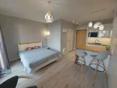 Łóżko lub łóżka w pokoju w obiekcie LuxApartmentWarszawa z bezpłatnym podziemnym parkingem