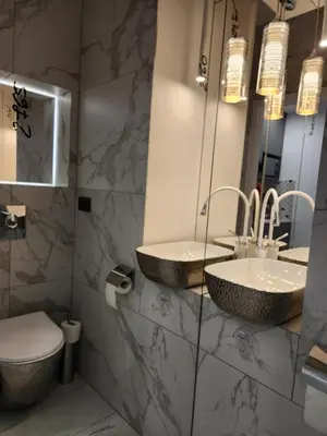 Łazienka w obiekcie JACUZZI & SAUNA Apartament Warszawa Mokotów