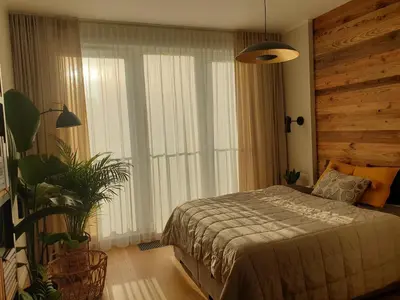 Łóżko lub łóżka w pokoju w obiekcie Harmony Apartment