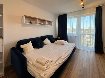 Łóżko lub łóżka w pokoju w obiekcie Healthy Life Apartment