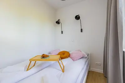 Łóżko lub łóżka w pokoju w obiekcie ShortStayPoland Jagiellońska (B134)