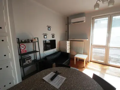 Łóżko lub łóżka w pokoju w obiekcie Studio Narutowicza