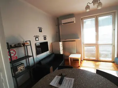 Łóżko lub łóżka w pokoju w obiekcie Studio Narutowicza