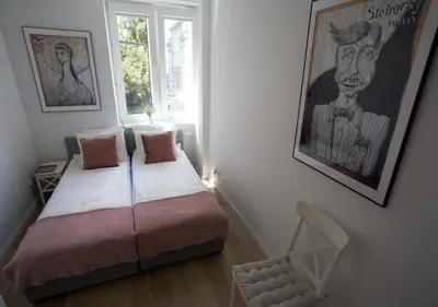Łóżko lub łóżka w pokoju w obiekcie apART!ment