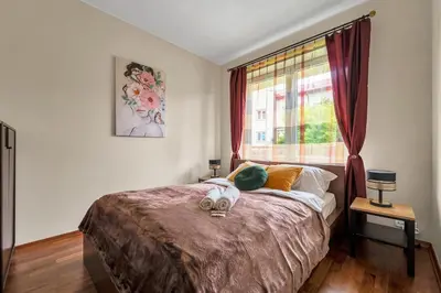Łóżko lub łóżka w pokoju w obiekcie 90m2 Prestige Suite - Parking & Jacuzzi & AirCon by Rentujemy