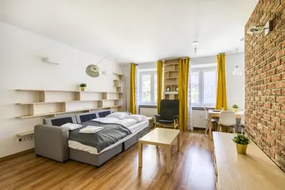 Łóżko lub łóżka w pokoju w obiekcie Labo Apartment Plac Grzybowski