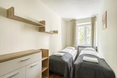 Łóżko lub łóżka w pokoju w obiekcie Labo Apartment Plac Grzybowski