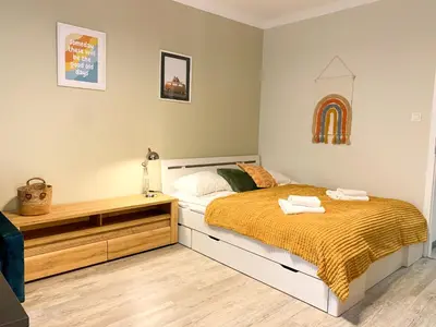 Łóżko lub łóżka w pokoju w obiekcie Good Days Apartment