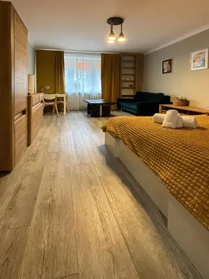 Łóżko lub łóżka w pokoju w obiekcie Good Days Apartment