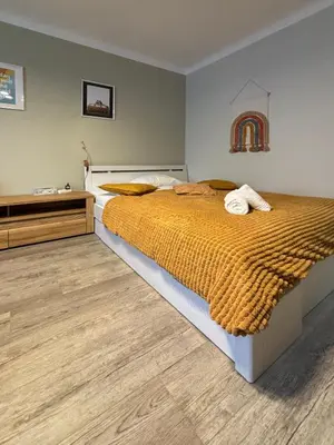 Łóżko lub łóżka w pokoju w obiekcie Good Days Apartment