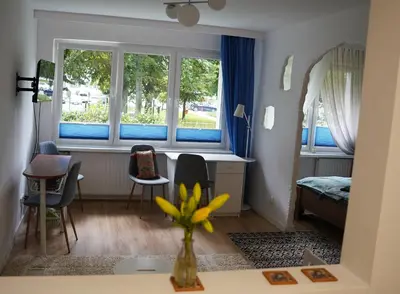 Część wypoczynkowa w obiekcie Nice apartament with small tub