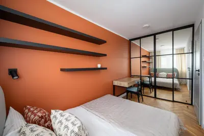 Łóżko lub łóżka w pokoju w obiekcie Bielany Comfort Apartment by BookingHost