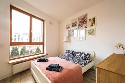 Łóżko lub łóżka w pokoju w obiekcie Apartment Wilanow Branickiego