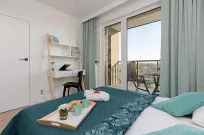 Łóżko lub łóżka w pokoju w obiekcie Praga Apartment with Parking by Noclegi Renters