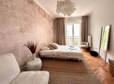 Łóżko lub łóżka w pokoju w obiekcie Warsaw Concierge Wiatraczna