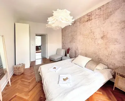 Łóżko lub łóżka w pokoju w obiekcie Warsaw Concierge Wiatraczna