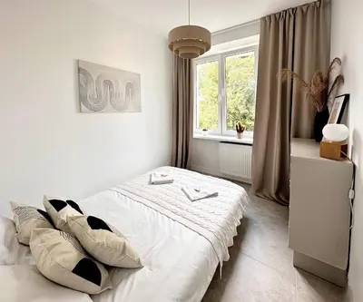 Łóżko lub łóżka w pokoju w obiekcie Warsaw Concierge Wiatraczna