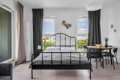 Łóżko lub łóżka w pokoju w obiekcie 8th Floor Downtown Warsaw Apartments N2 - Parking, City View, Balcony - by RENTUJEMY